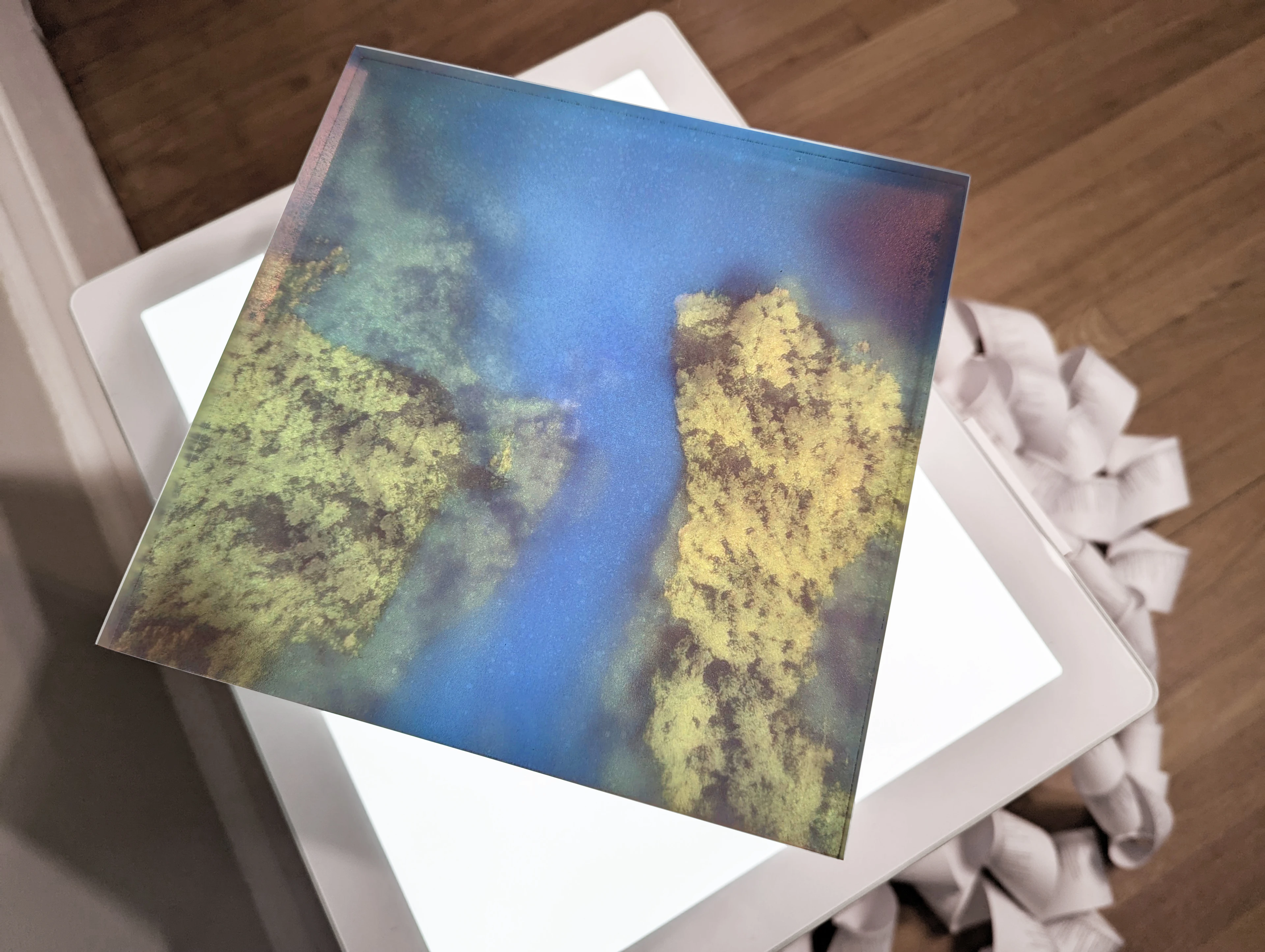 Translucent layers from a vector through high-dimensional space depict ghostly aerial imagery.